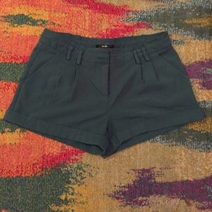 Green mid-rise pleated shorts