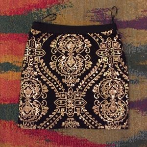 Black and gold sequined mini skirt