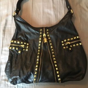 Black with gold hardware Betsey Johnson handbag.