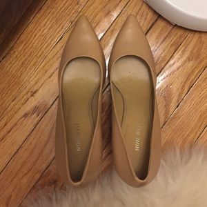 Nude pointed toe pumps