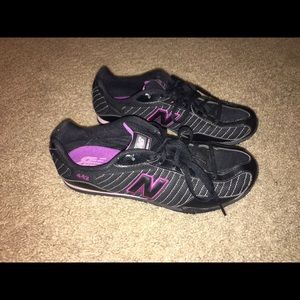 New Balance black shoes with light purple accents