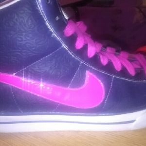 Pink and purple Nike high tops