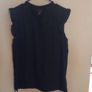 Sleeveless black ruffled shoulder dress shirt