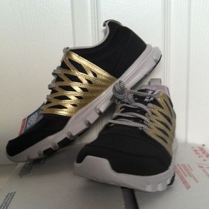 Reebok Yourflex Trainette Black with gold trim.
