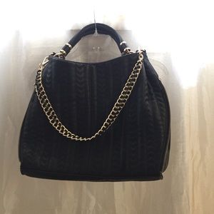 Black purse, gold detail black chevron stitching
