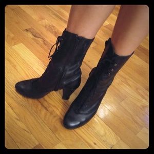 Lace up black leather boots. Victorian style