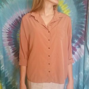 Peach colored, over sized button down shirt