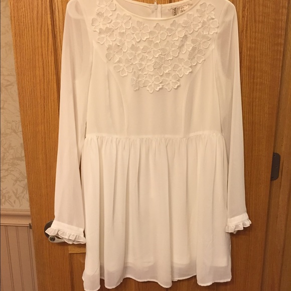 White dress with flowers and bell sleeves