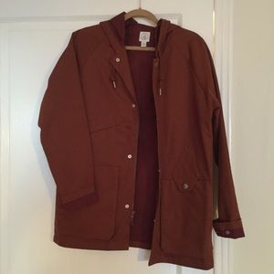 Rust colored boyfriend fit rain jacket by Volcom