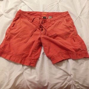 Samon colored board shorts