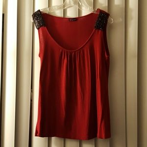 Red sleeveless top with black beading