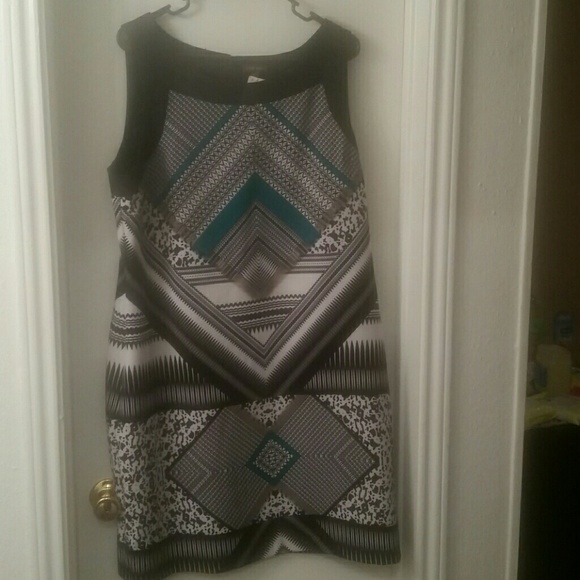 Green, black and white print dress.