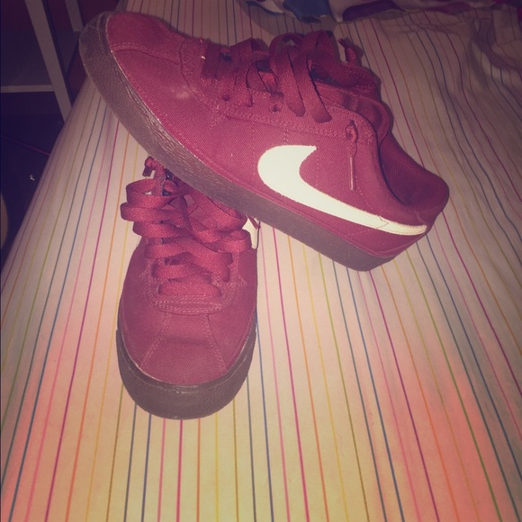 Maroon Nike sneakers