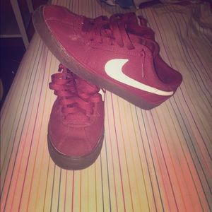 Maroon Nike sneakers