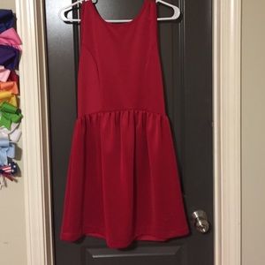 Simple red dress, bow on lower back, dips low