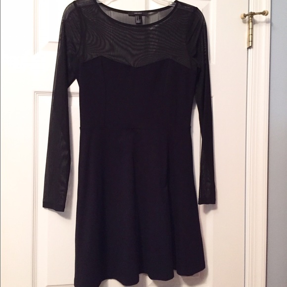 Black skater dress with sheer sleeves and neckline