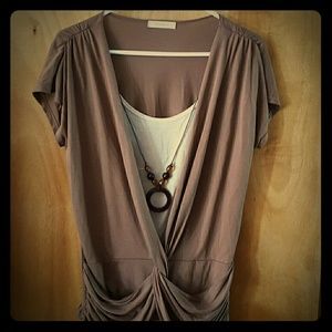 Brow and beige shirt