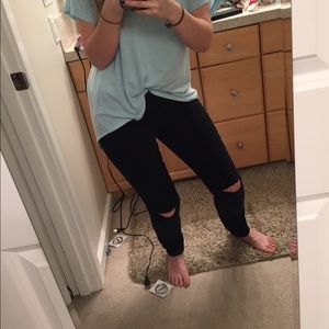 Black skinny jeans with holes in knee