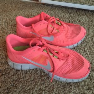 Nike Frees 5.0! Size 8, pretty bright pink.