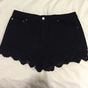 Black Jean shoes with fringe at the bottom