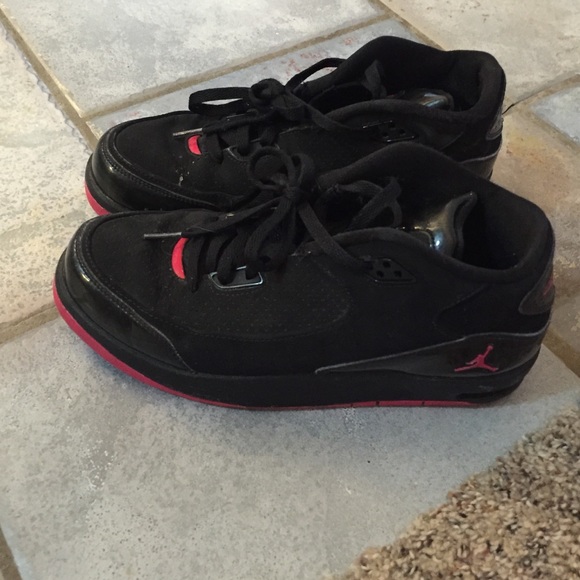 Black and pink Jordan's