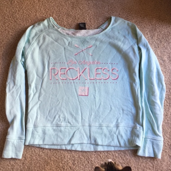Young and reckless off the shoulder sweatshirt