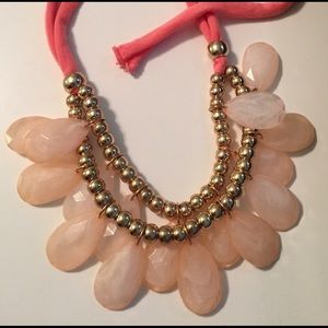 Coral statement necklace with ties.