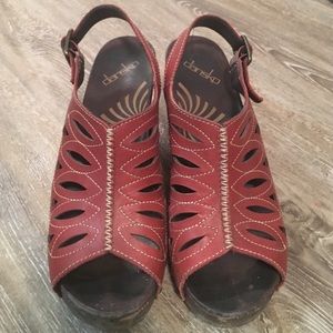 Red Dansko clog pumps