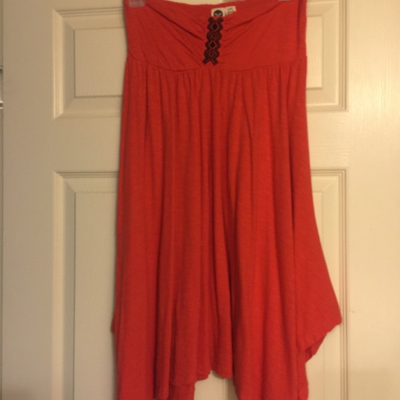 Orange asymmetrical, strapless dress by Roxy.