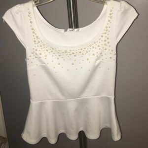 White peplum top with pearl beading