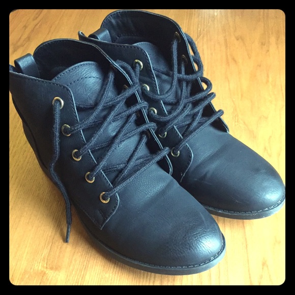 Black booties with gold detailing