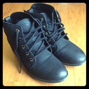 Black booties with gold detailing