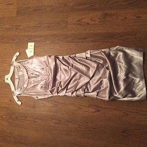 Really nice never before worn dress! Form fitting!