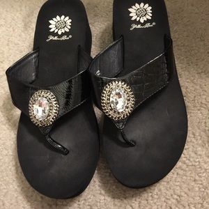 Yellow box black flip flops with a jeweled accent