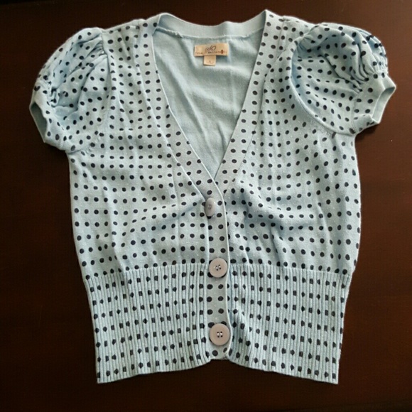 Blue polka dot cardigan.