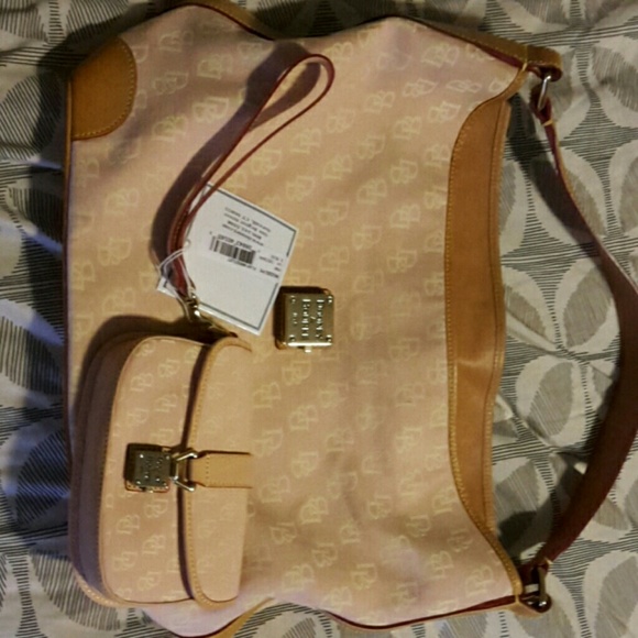 Gently used Dooney Bourke purse with New matching