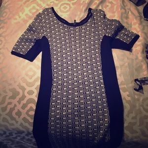 A black and white semi body con dress.