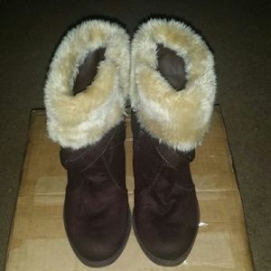 Women's brown heeled boots.