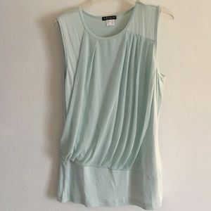 Pastel tank with sheer cross body pleats.