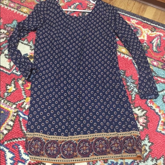 Navy dress with multi-colored pattern.