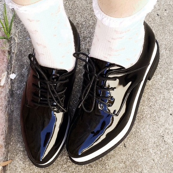 Black patent loafers with white platforms