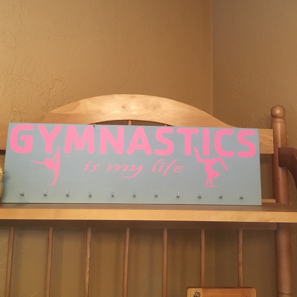 A hang able " GYMNASTICS is my life " coat hanger
