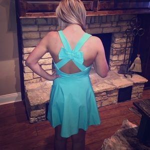 Teal flared mini with strappy back bow!