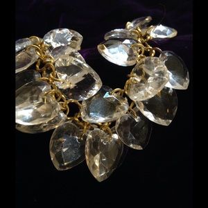 Crystal heart bracelet on gold tone chain.