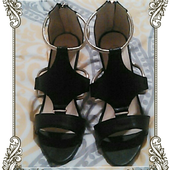 Black with gold straps shoes.