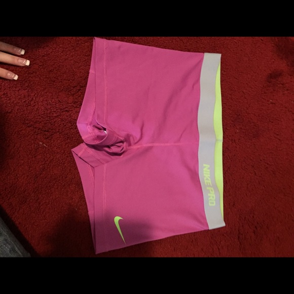 Never worn pink and green Nike pros