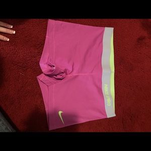Never worn pink and green Nike pros