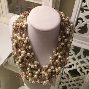 Multi-strand pearl choker.