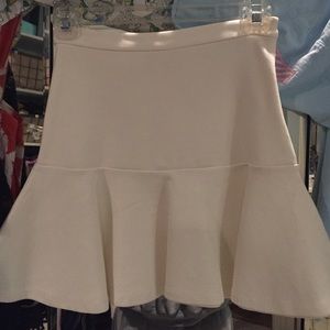 Cream colored skirt. Stretchy material
