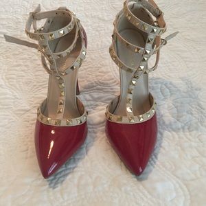 Red patent leather rock stud heels